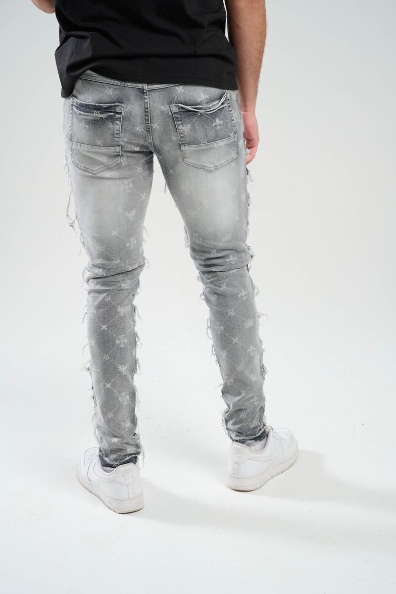 TAKER-PREMIUM STRETCH SLIM FIT JEANS WITH DISCHARGE PRINT & FRAYED PATCH