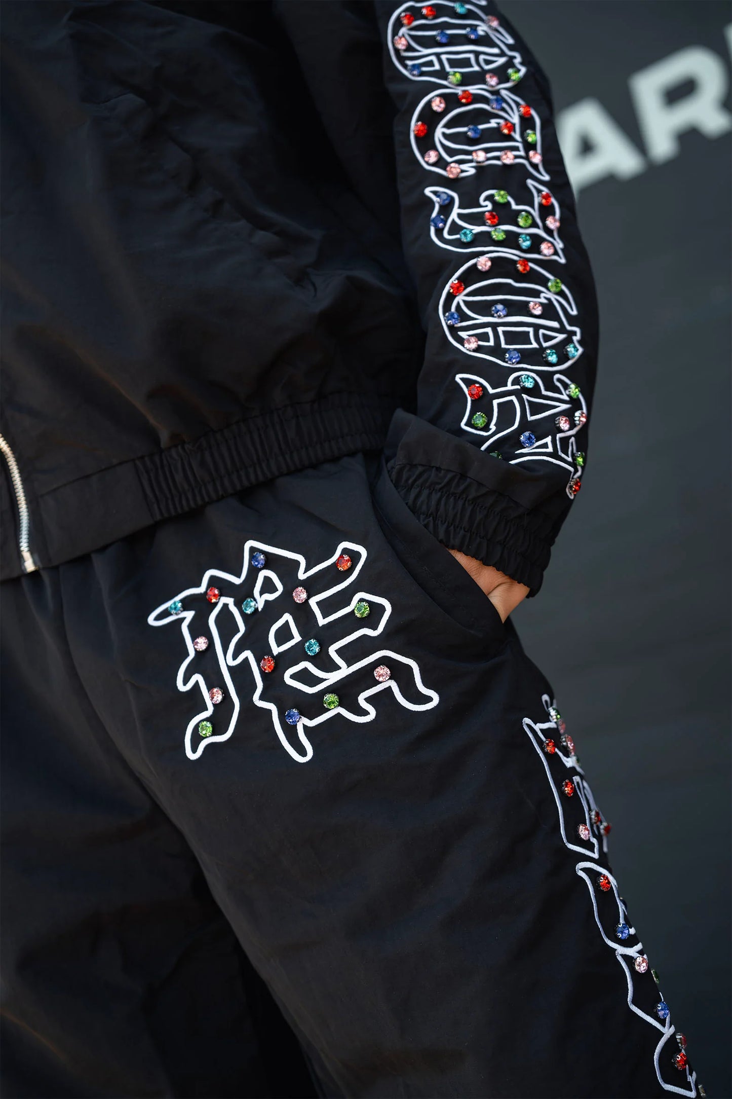 MIXED EOMTION-ME” rhinestone Nylon Pants
